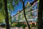 Kuren in Polen: Ansicht des Erholungshaus Maximus SPA in Wald Dziwnowek Ostsee